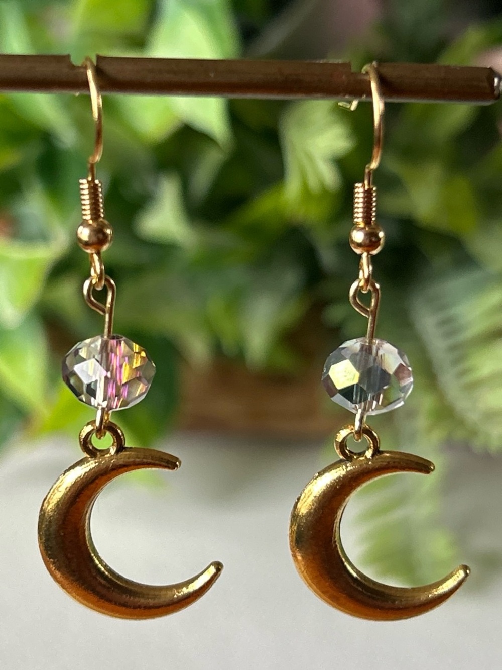 Handmade gold moon earrings with blue AB crystal beads